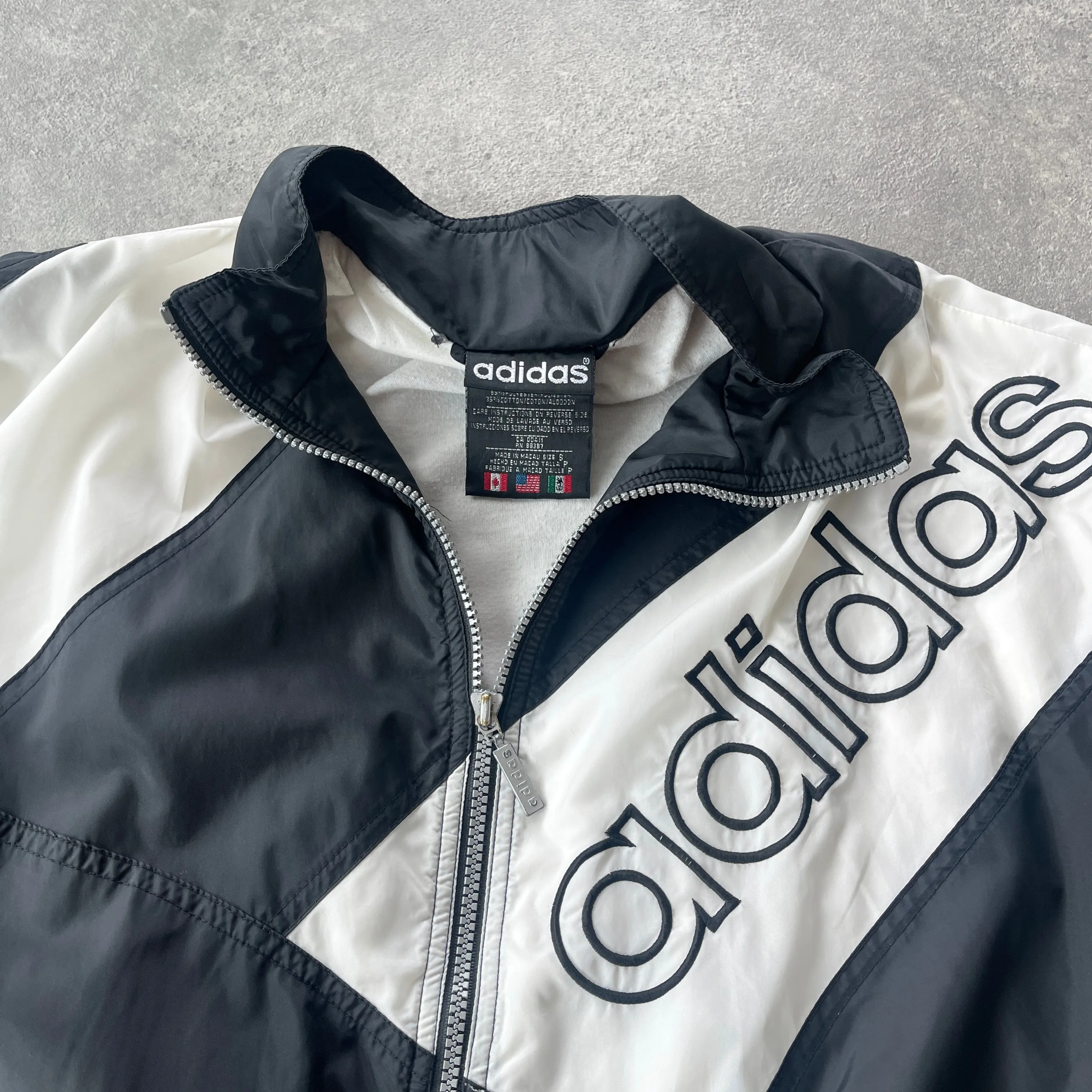 Adidas 1990s lightweight embroidered spellout shell jacket (S)